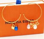 Louis Vuitton Pearl Gold Charm Hoop Earrings - Image 6