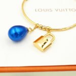 Louis Vuitton Pearl Gold Charm Hoop Earrings - Image 8