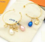 Louis Vuitton Pearl Gold Charm Hoop Earrings - Image 2