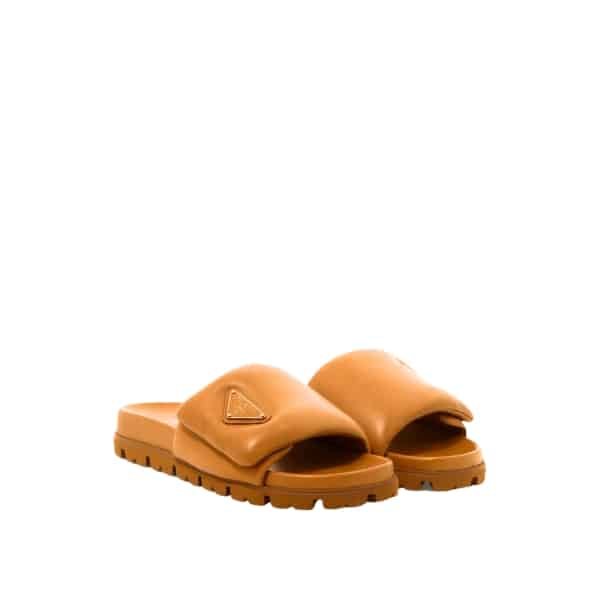xr:d:DAFlMgfvQtQ:53,j:1866009423345307377,t:23061307 Prada Soft Padded Nappa Leather Slides Brown - Image 1