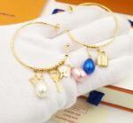 Louis Vuitton Pearl Gold Charm Hoop Earrings - Image 3